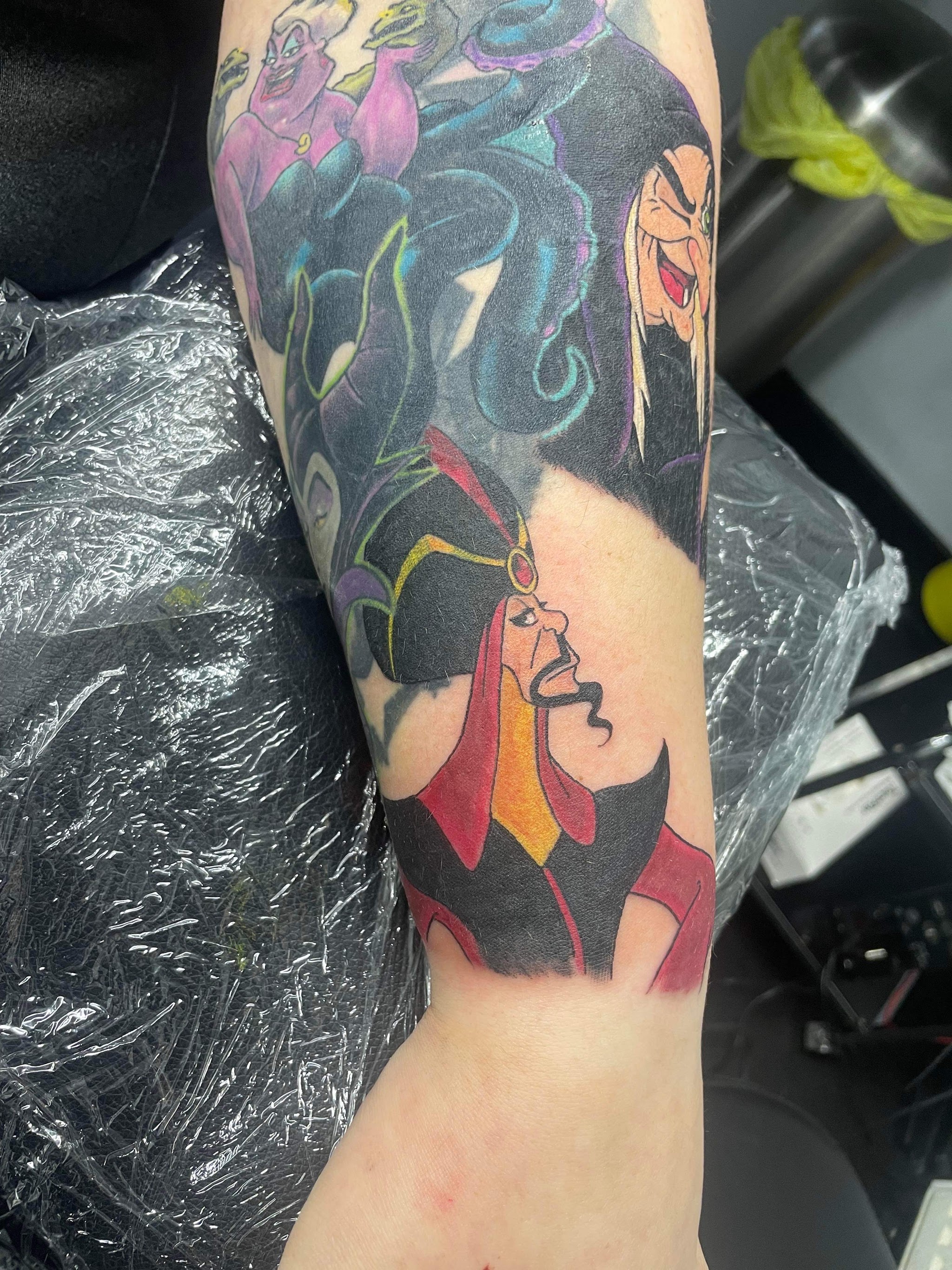 Colour Disney villains sleeve tattoo, forearm