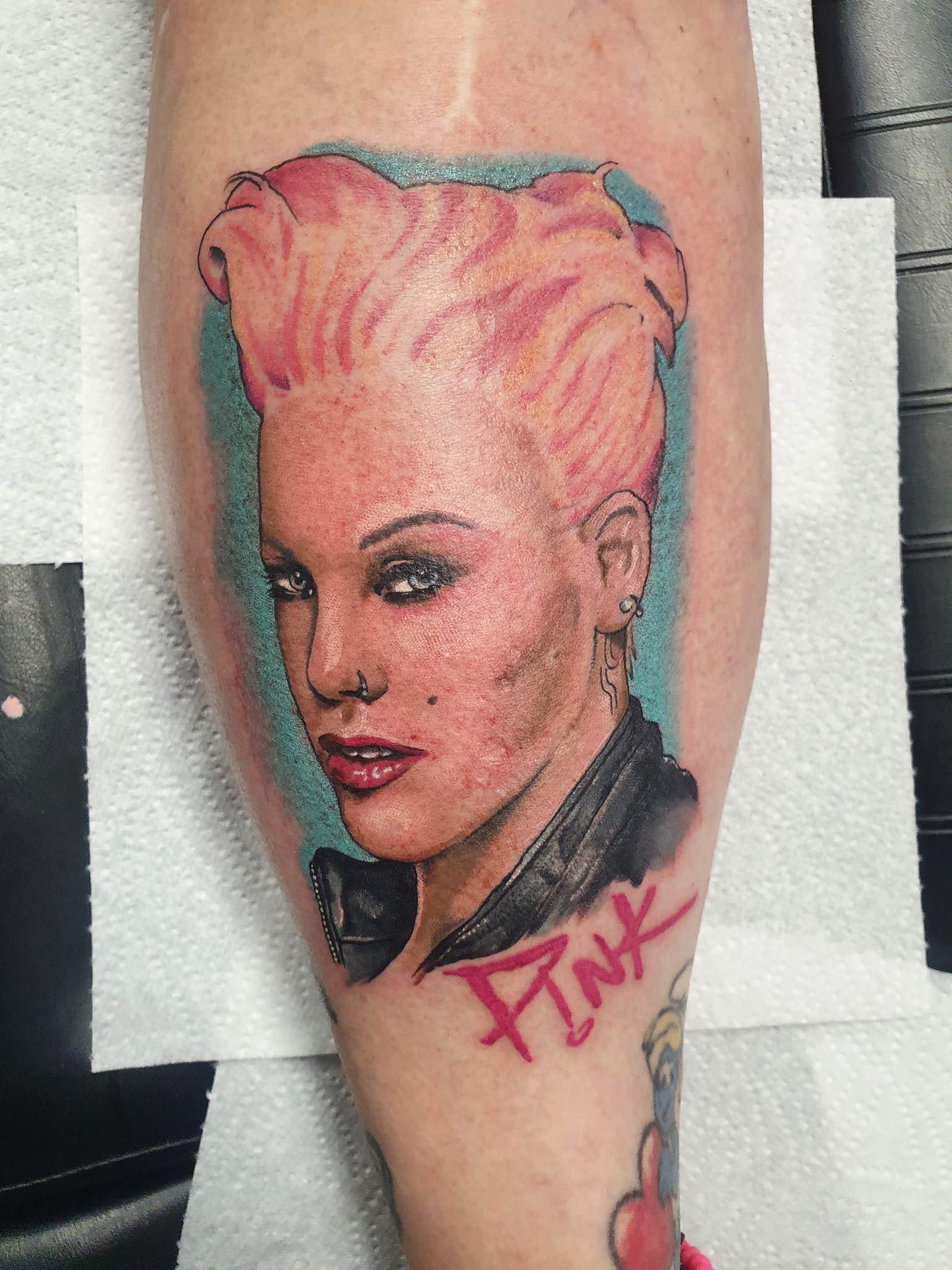 Colour realism portrait tattoo with pink hair, calf piece